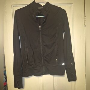 black Alo Yoga athletic zip-up jacket featuring fitted seaming and thumbholes